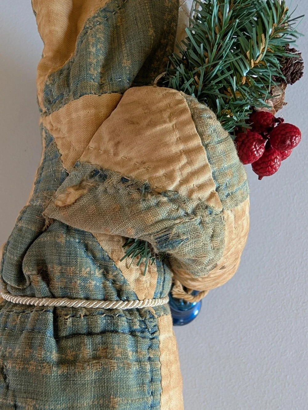 FOLK ART SANTA CLAUS wearing an antique quilt